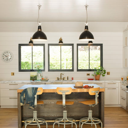 Kitchen featuring Edgecliff Pull cabinet hardware on white cabinetry and a wood island