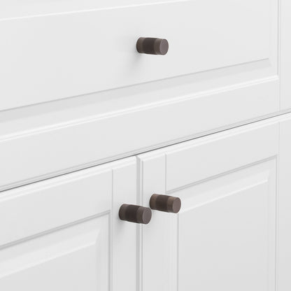 Side view of the Knurled Knob showcasing its cross-hatched texture with white paneled cabinet doors