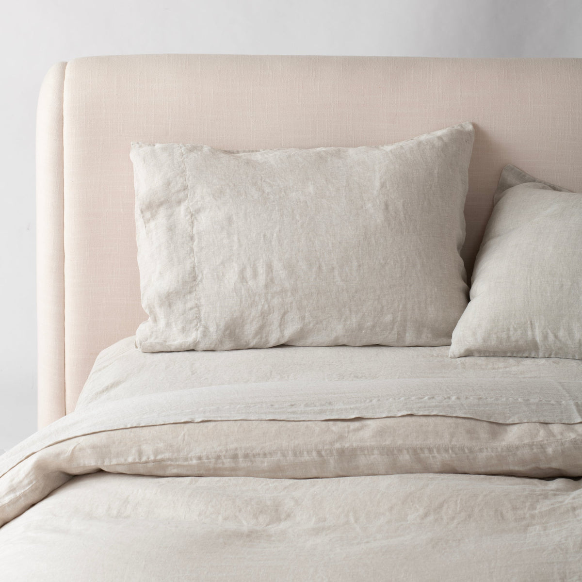Front view of Linen Bedding Sham showcasing textured linen fabric on a made bed