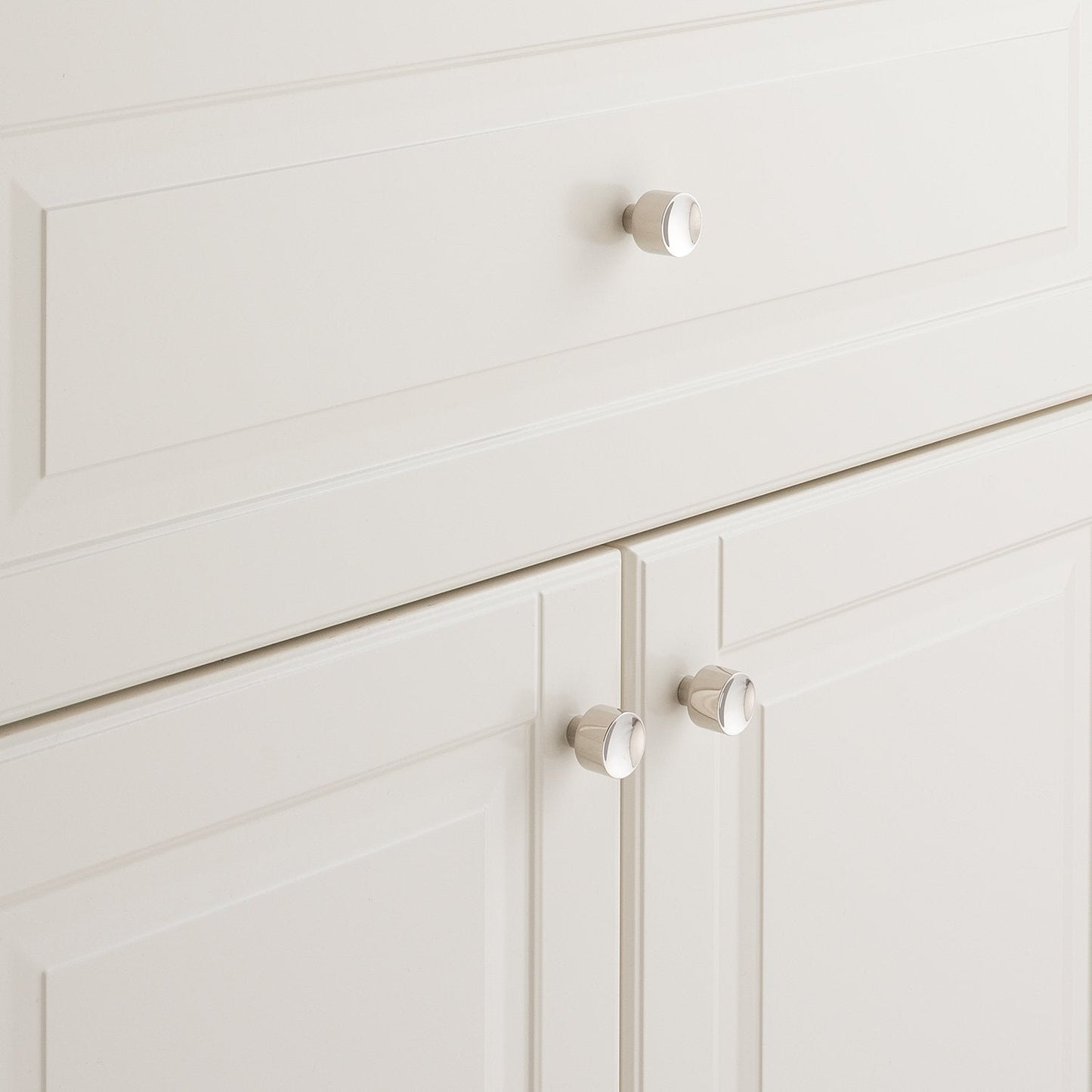Mid Century Knob installed on white paneled cabinetry