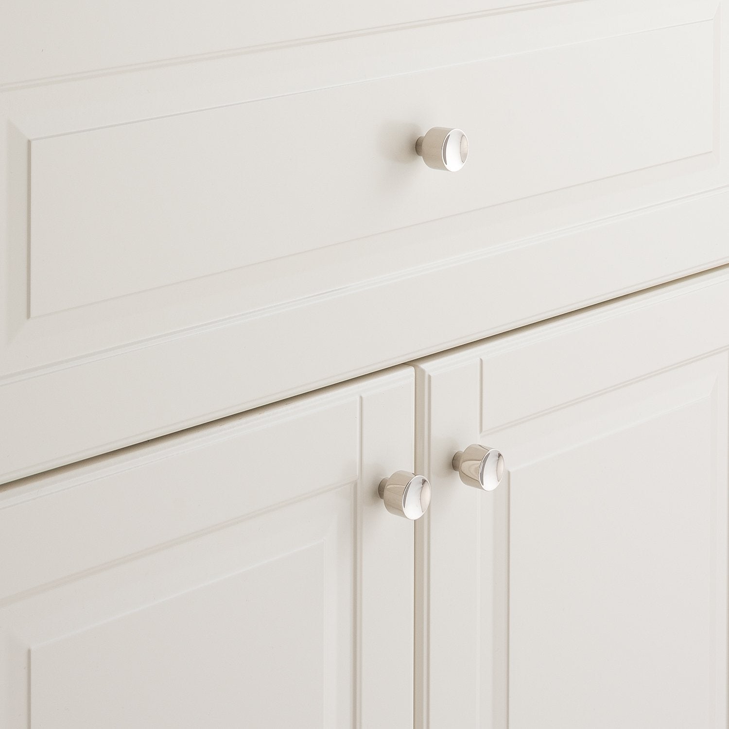 Mid Century Knob installed on white paneled cabinetry