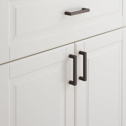 Close-up of Edgecliff Pull showcasing dark rectangular bar pulls on white paneled cabinetry