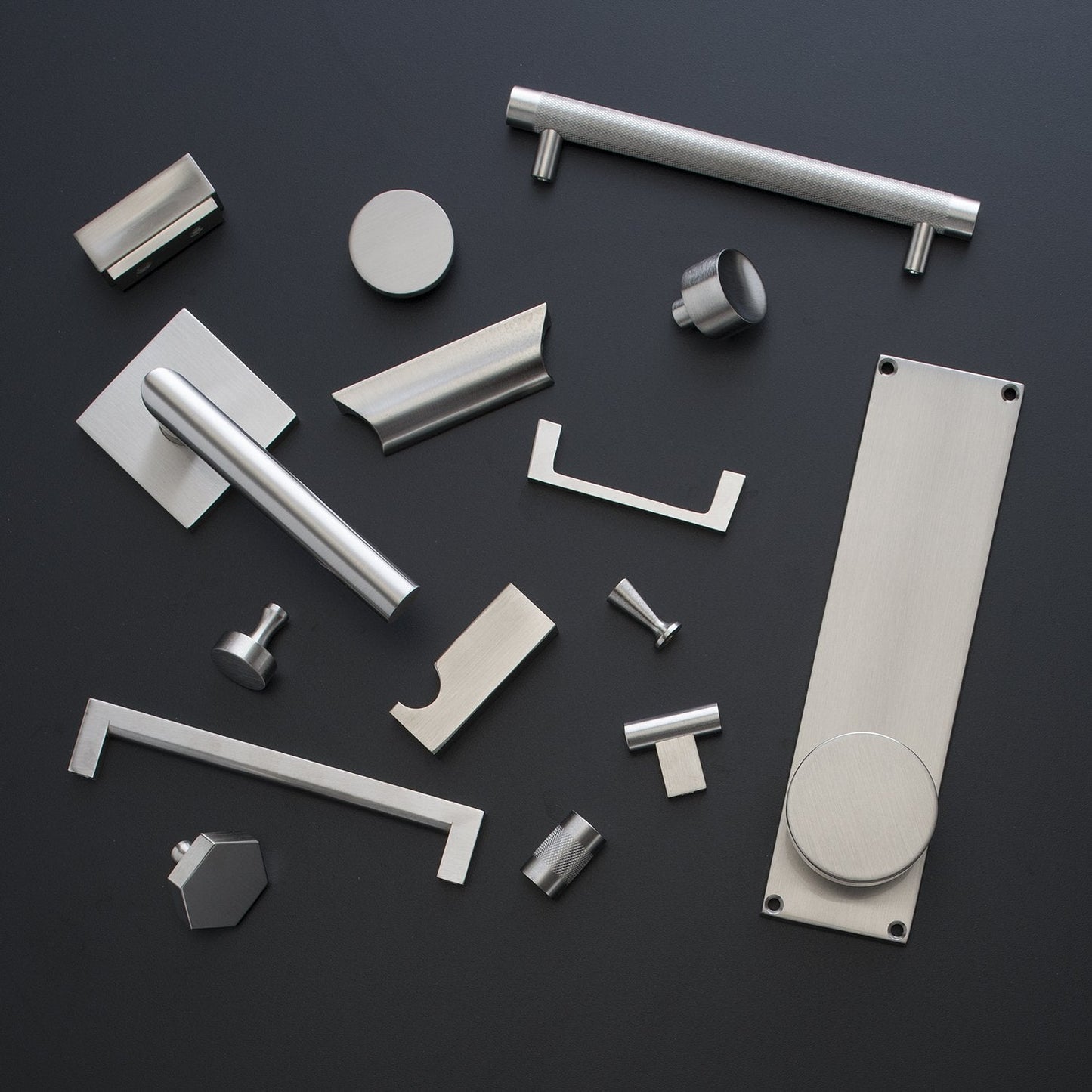 Overhead view of Edgecliff Pull showcasing brushed metal hardware on a black background