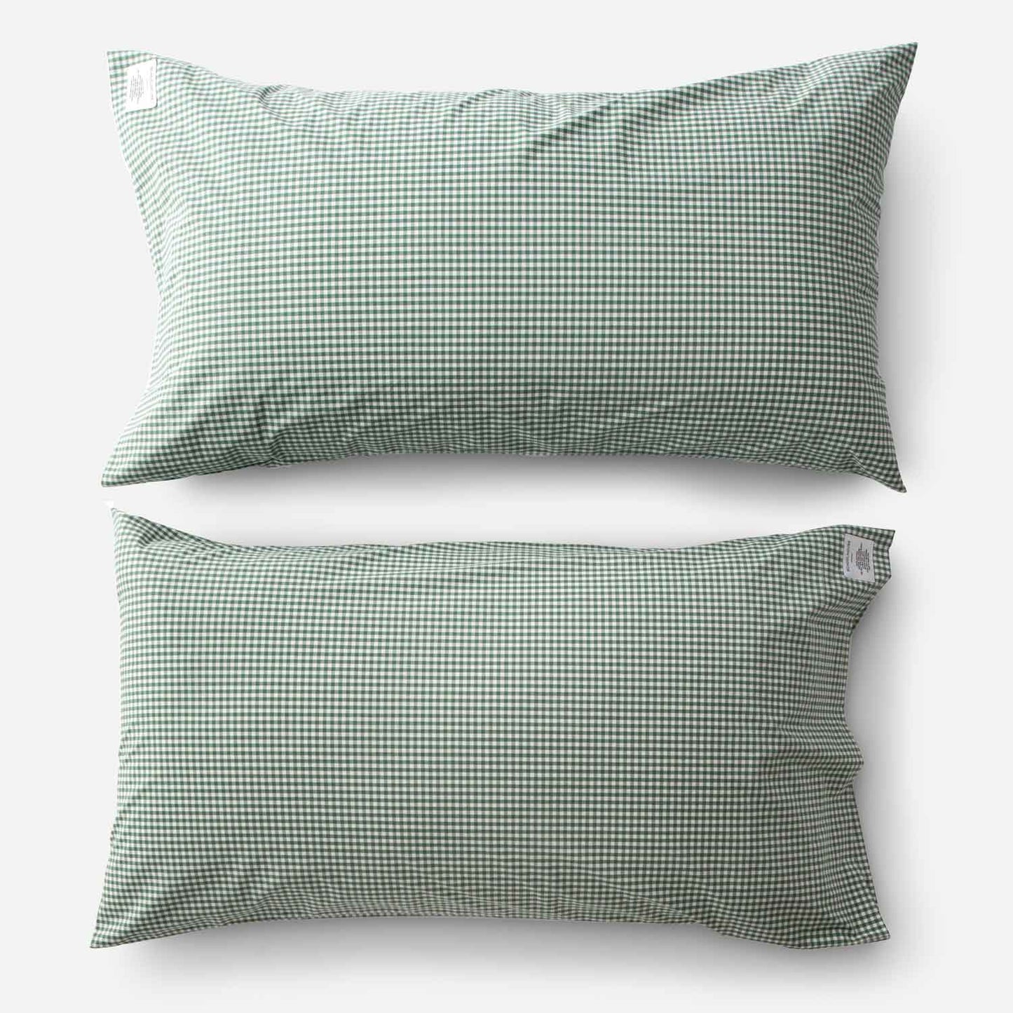 Top-down view of Gingham percale pillowcase set showcasing juniper green gingham check on white background