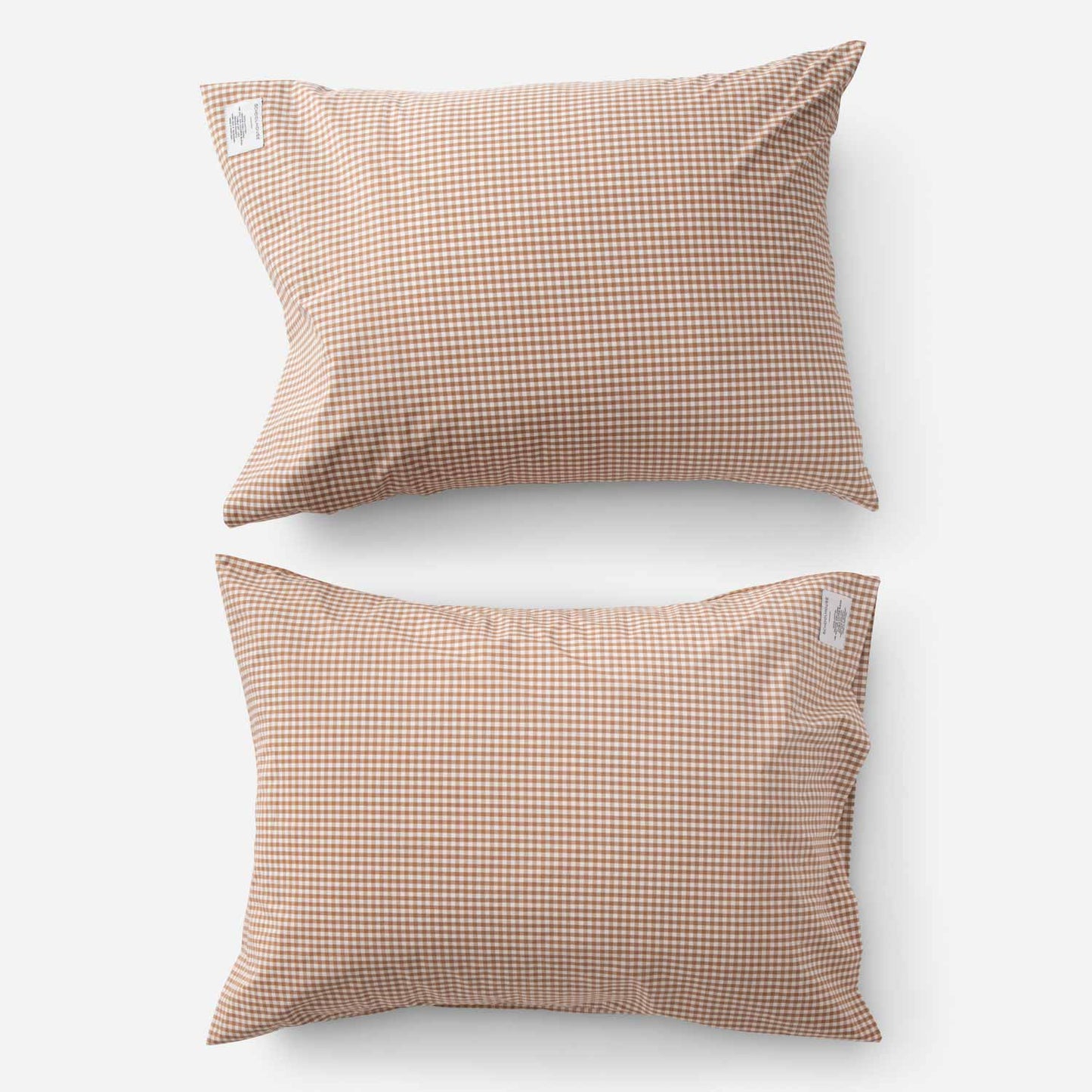 Top-down view of Gingham Pillowcase Set showing two pillowcases with russet gingham check pattern on white background