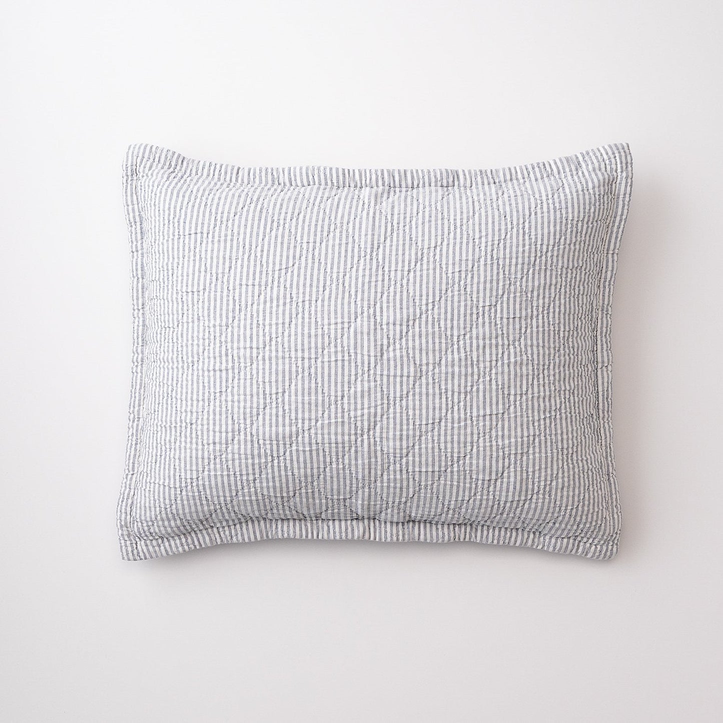 Front view of Diamond Ticking Quilted Pillow Sham with gray-and-white ticking stripes and diamond quilting on white