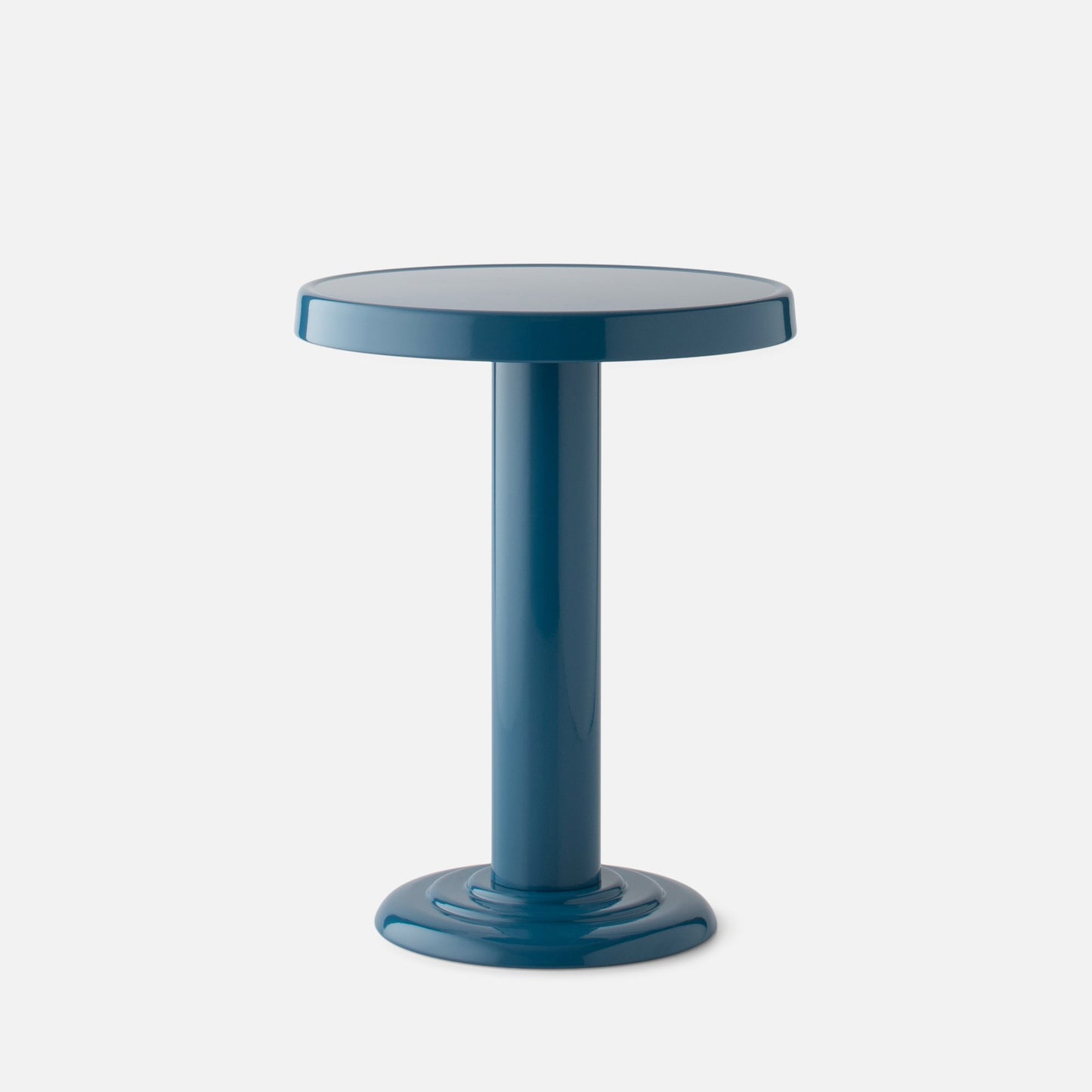 Close-up front view of Owen Side Table in Pool-Gloss showing round top and cylindrical base on light gray background